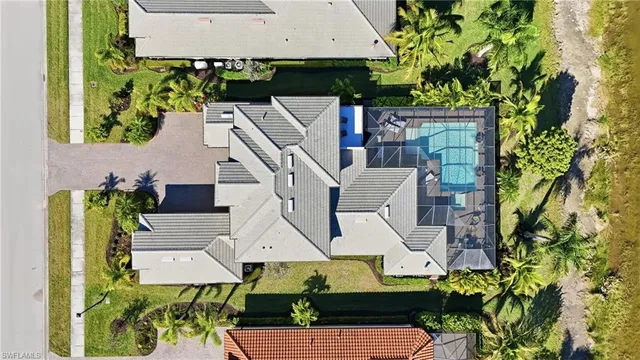 an aerial view of a house with swimming pool