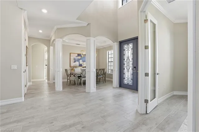 a living room with furniture and a large mirror