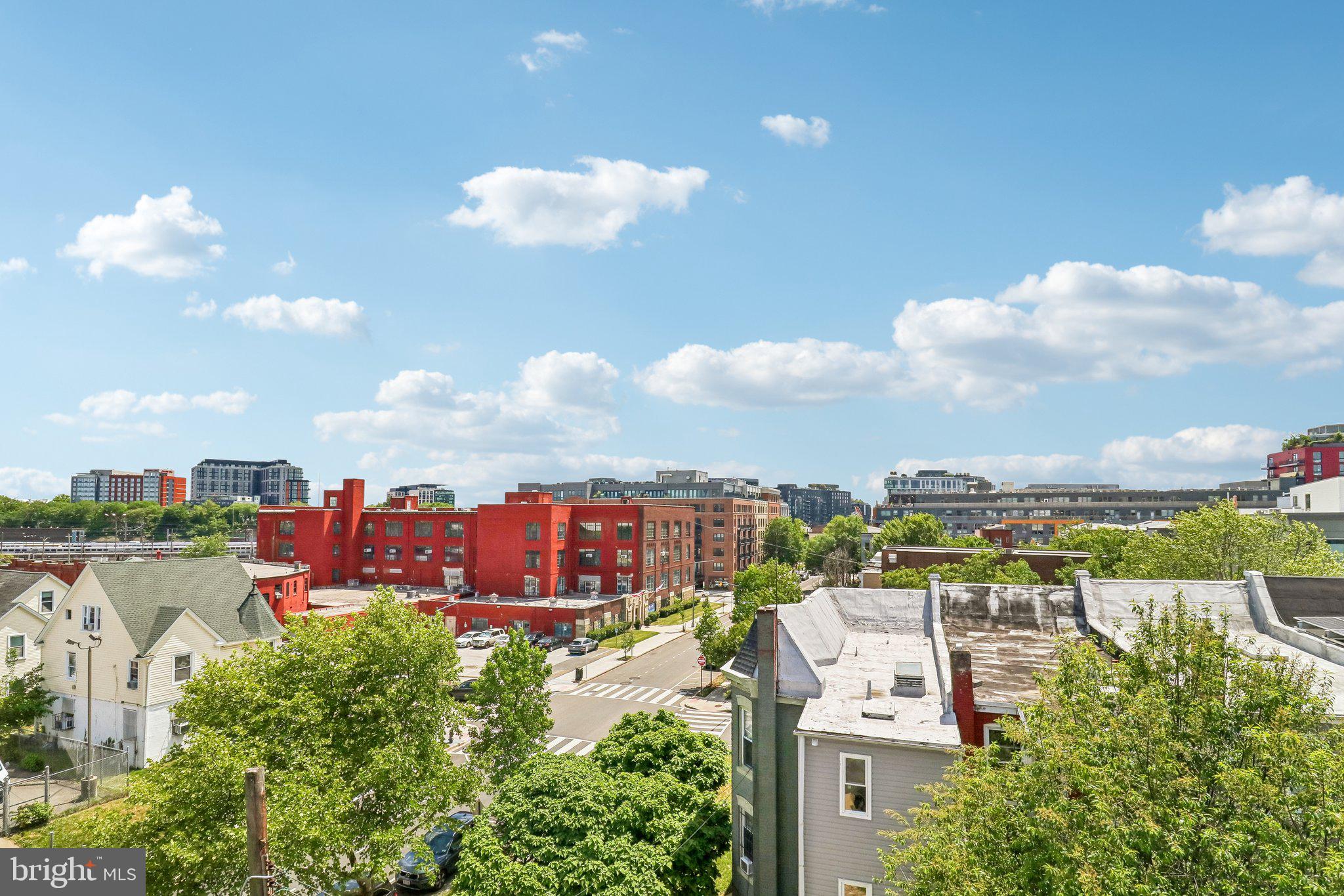 233 S Street Northeast, Unit 5 Washington, DC 20002 - Photo 35 of 41 Urban skyline under a bright sky.