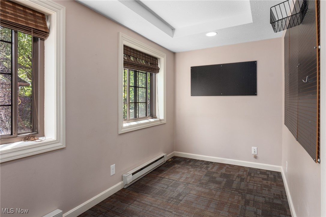 3677 Traver Road Shaker Heights, OH 44122 - Photo 7 of 35 Spare room with a baseboard heating unit, healthy amount of natural light, baseboards, recessed lighting, and a raised ceiling