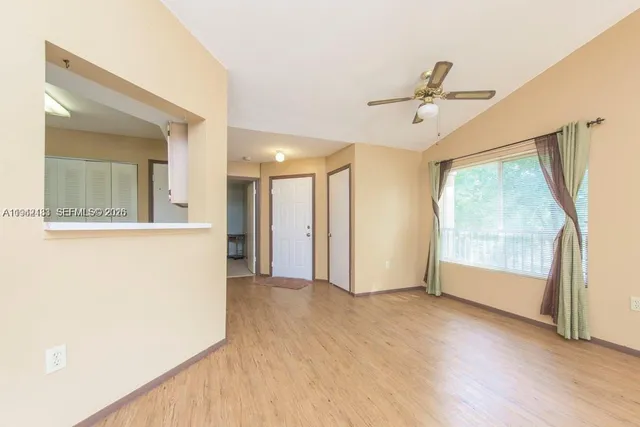 a view of an empty room with a window