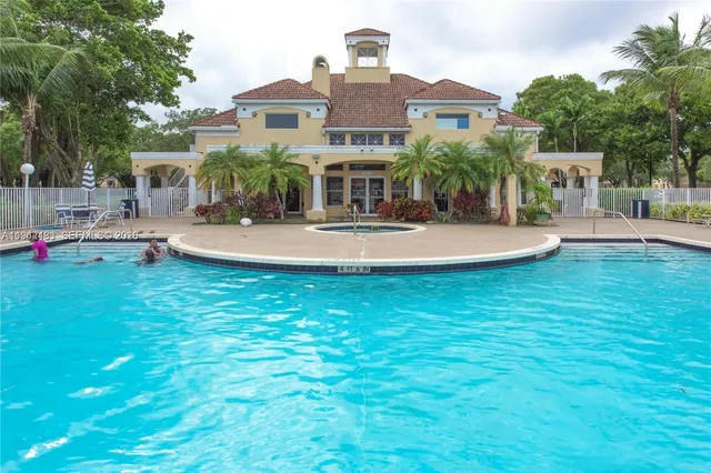 a front view of house with yard and outdoor seating