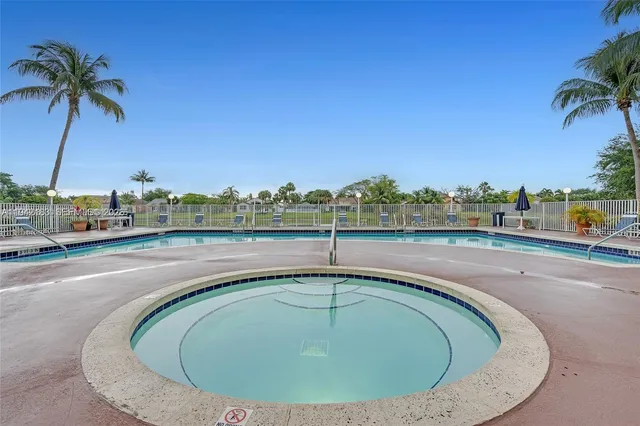 a view of a swimming pool with a terrace
