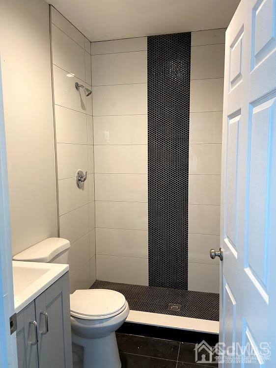 55 Devon Road, Unit A Colonia, NJ 07067 - Photo 3 of 10 a bathroom with a sink a toilet and shower