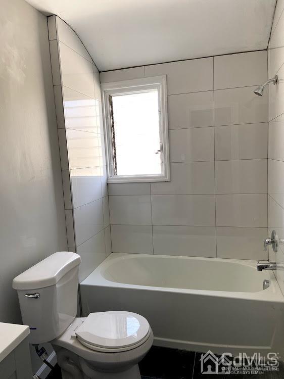 55 Devon Road, Unit A Colonia, NJ 07067 - Photo 9 of 10 a bathroom with a toilet and a bath tub