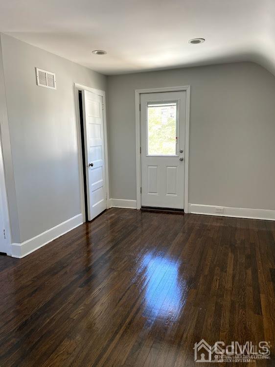 55 Devon Road, Unit A Colonia, NJ 07067 - Photo 10 of 10 an empty room with wooden floor and windows