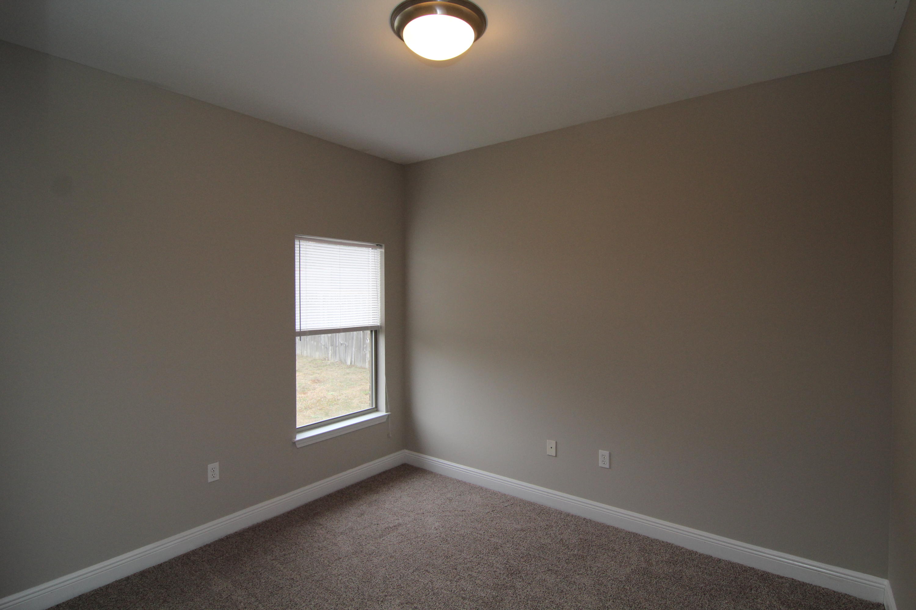 607 Rowan Circle Crestview, FL 32536 - Photo 9 of 17 a view of an empty room with a window