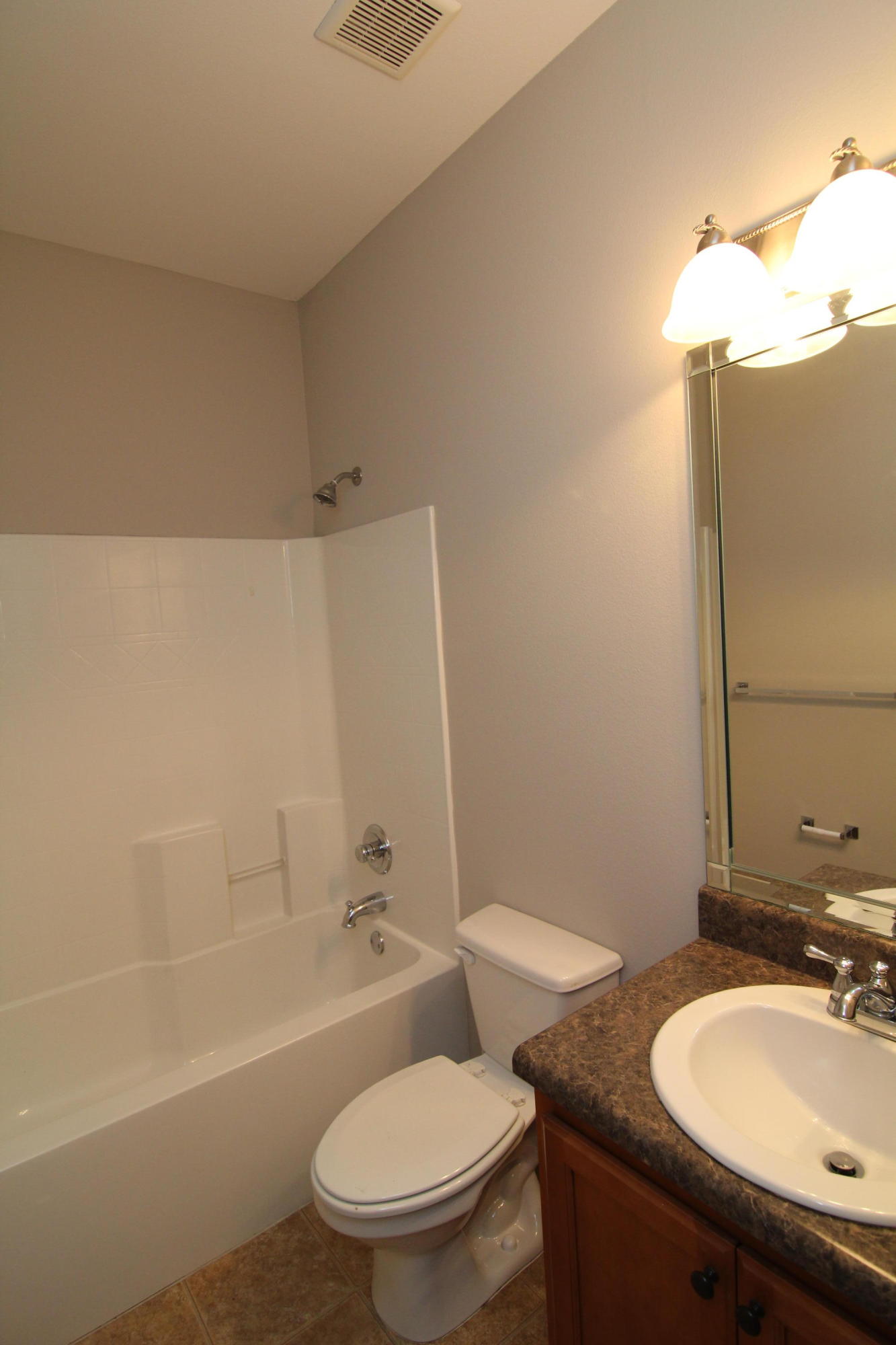 607 Rowan Circle Crestview, FL 32536 - Photo 10 of 17 a bathroom with a sink toilet and shower