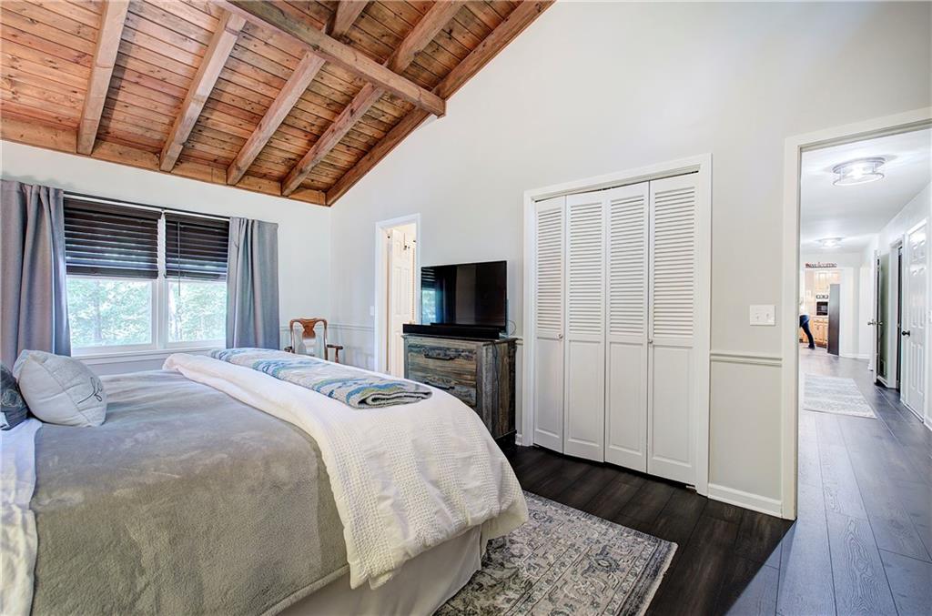 12 Tamarack Point Jasper, GA 30143 - Photo 29 of 83 a bedroom with a bed a flat screen tv and a exposed radiator