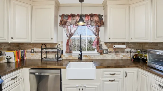 a kitchen with a sink and cabinets