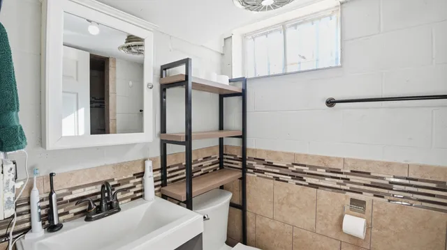 a bathroom with a sink and a mirror