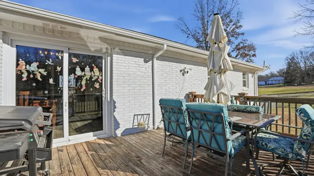 a view of a dinning tables and chairs in patio of the house