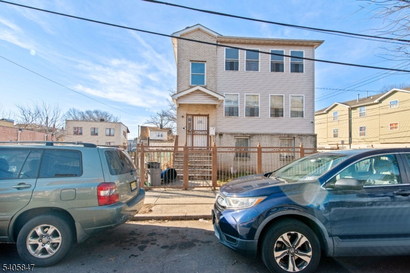 a view of a car parked in front of a house