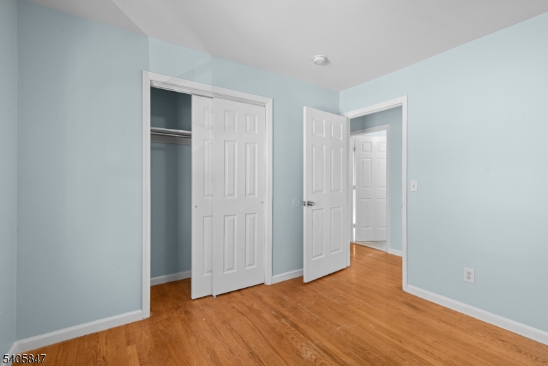 219 Clinton Place Newark, NJ 07112 - Photo 13 of 21 a view of empty room with wooden floor