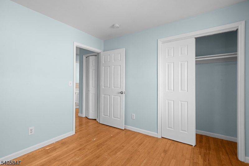 219 Clinton Place Newark, NJ 07112 - Photo 15 of 21 a view of an empty room with wooden floor