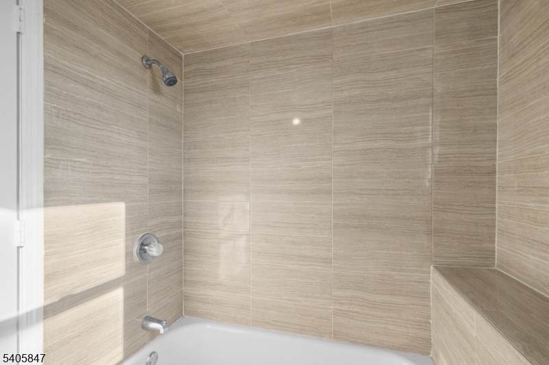 219 Clinton Place Newark, NJ 07112 - Photo 17 of 21 a bathroom with a shower