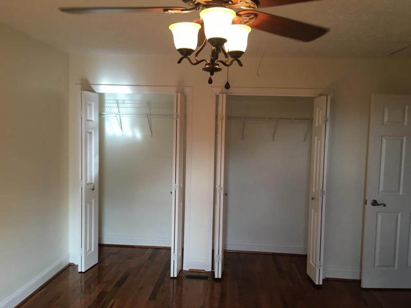 183 Midkiff Road Southeast Floyd, VA 24091 - Photo 26 of 35 a view of a hallway with wooden floor and a chandelier