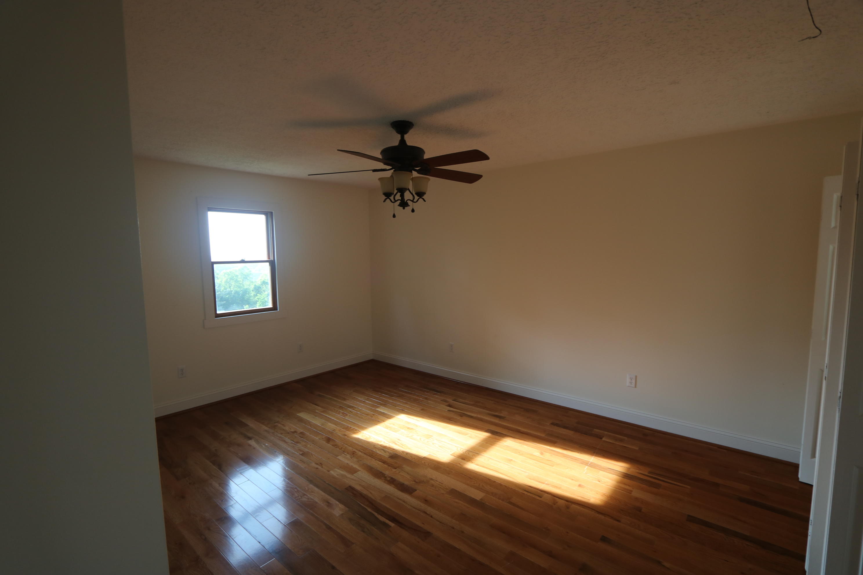 183 Midkiff Road Southeast Floyd, VA 24091 - Photo 32 of 35 wooden floor in an empty room with a window