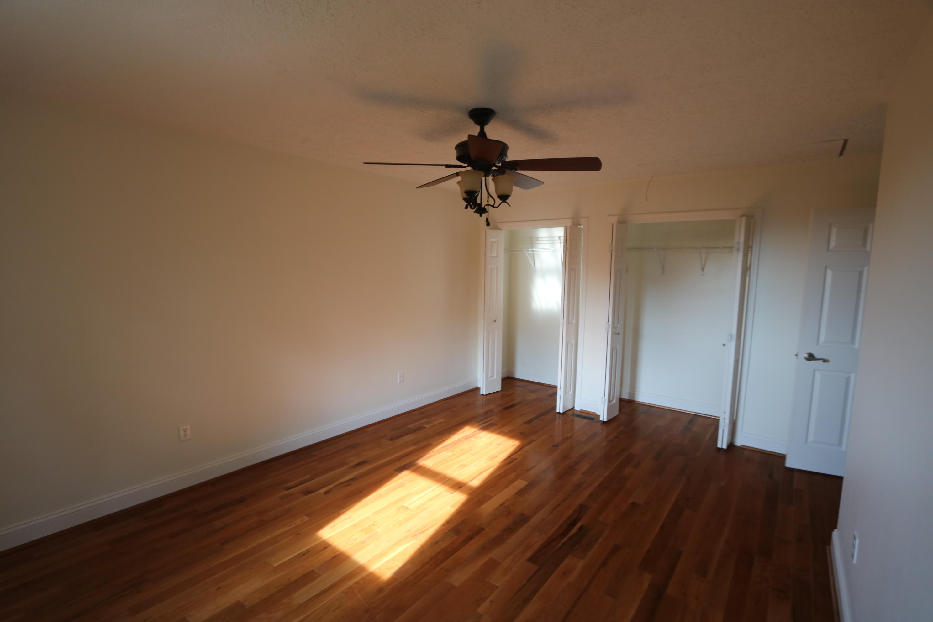 183 Midkiff Road Southeast Floyd, VA 24091 - Photo 33 of 35 a bedroom with a bed and a chandelier