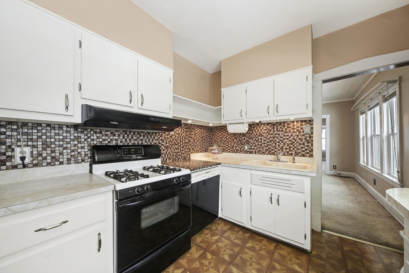 225 East Quincy Street Riverside, IL 60546 - Photo 11 of 32 a kitchen with granite countertop a stove sink and cabinets