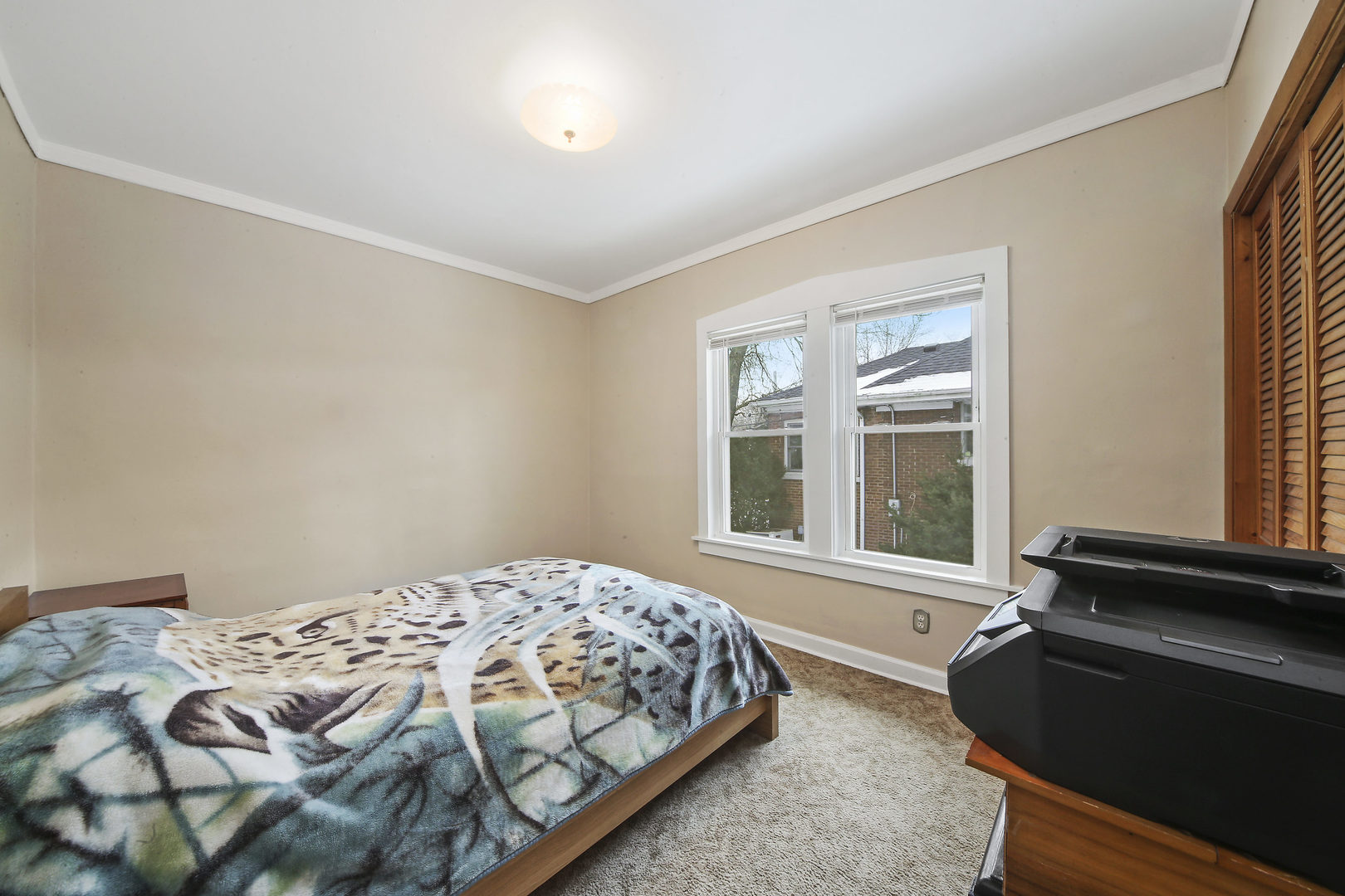 225 East Quincy Street Riverside, IL 60546 - Photo 12 of 32 a bedroom with a bed and a window