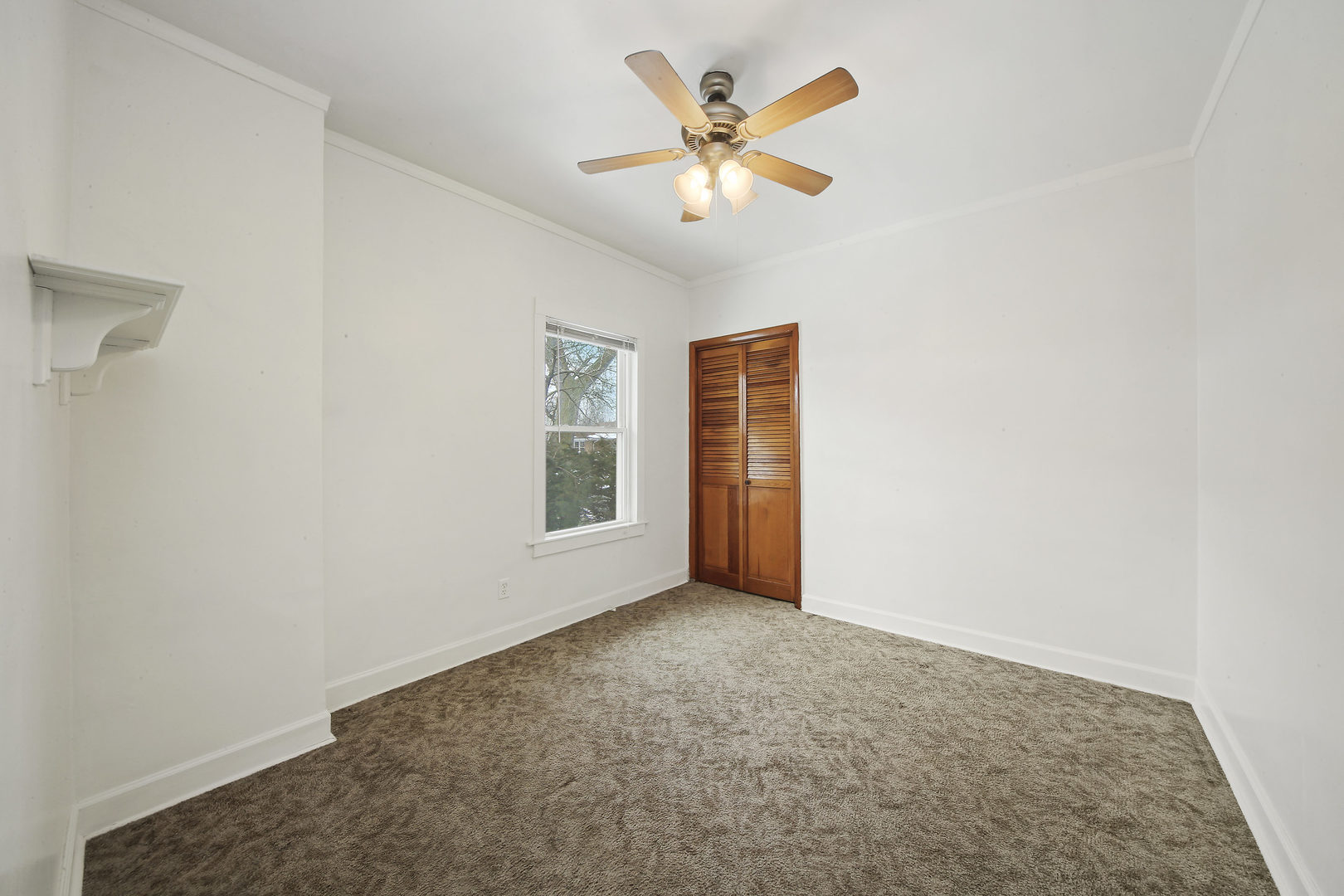 225 East Quincy Street Riverside, IL 60546 - Photo 13 of 32 an empty room with a window