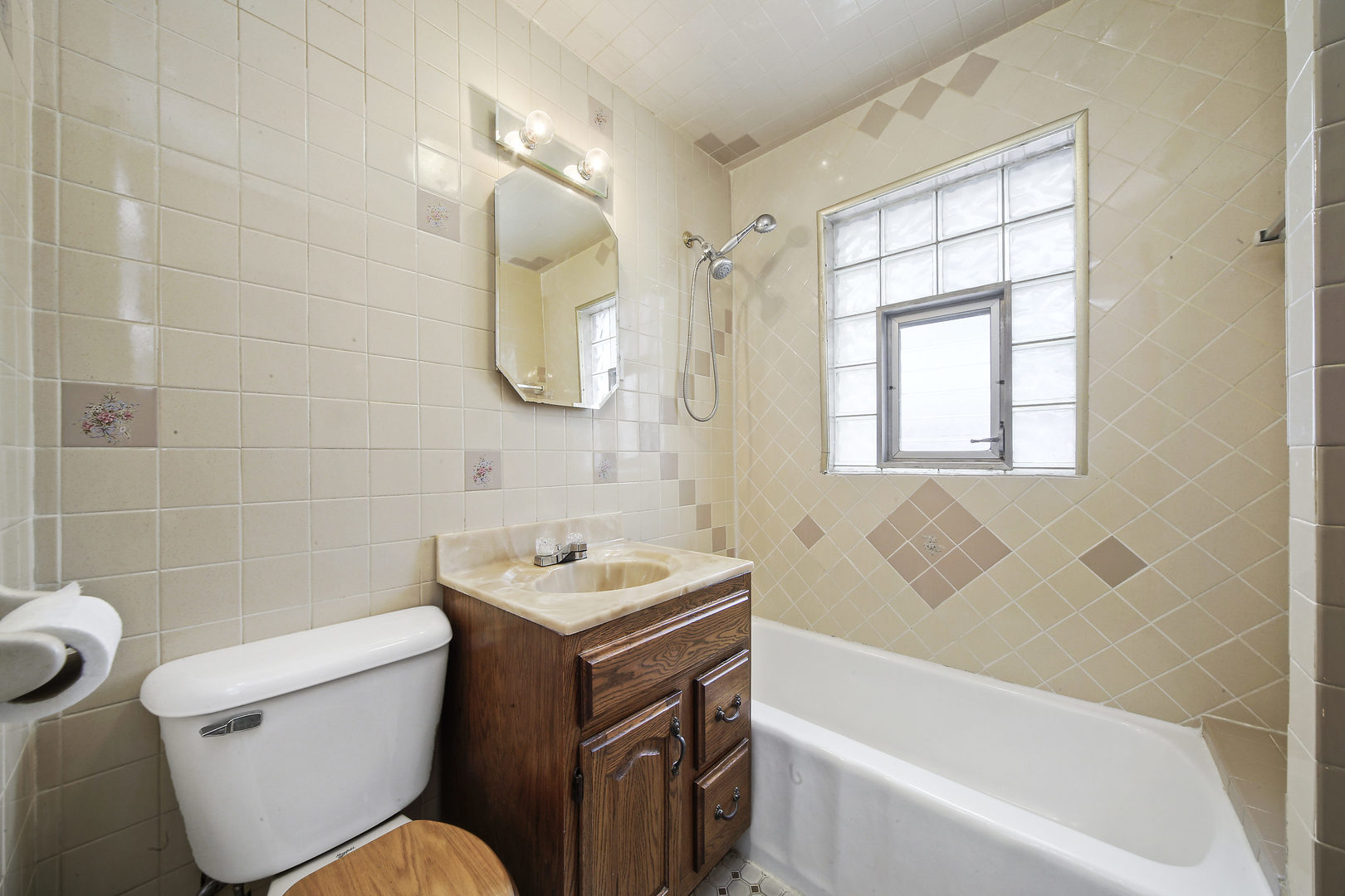225 East Quincy Street Riverside, IL 60546 - Photo 14 of 32 a bathroom with a sink toilet and shower