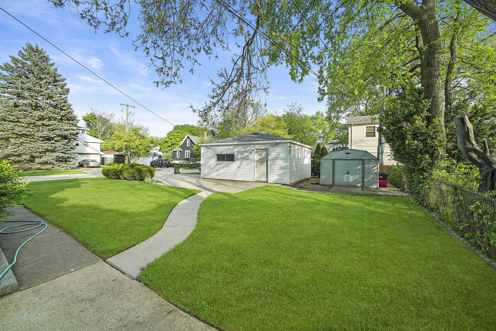 225 East Quincy Street Riverside, IL 60546 - Photo 26 of 32 a view of a house with a yard porch and sitting area