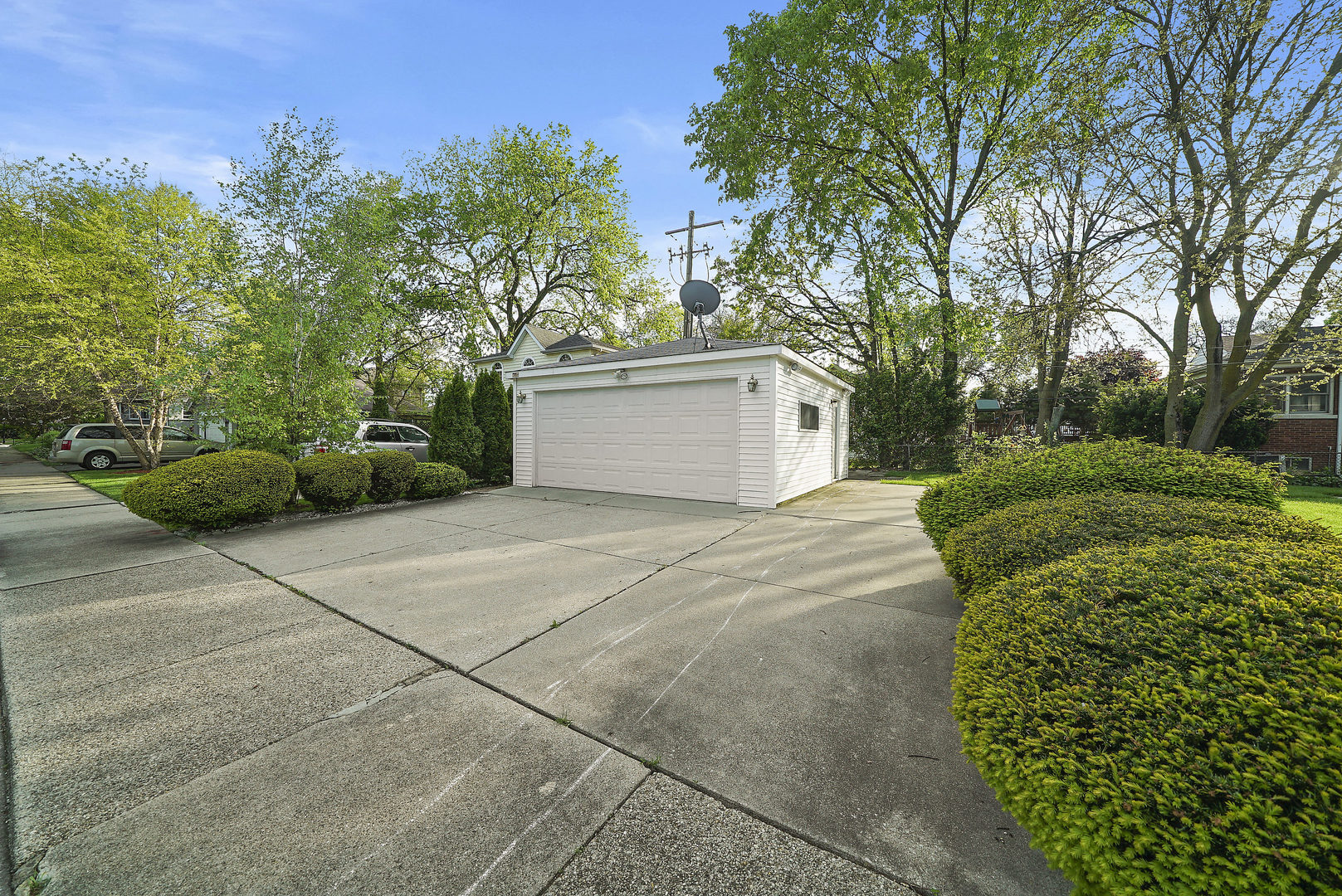 225 East Quincy Street Riverside, IL 60546 - Photo 29 of 32 a view of a backyard with plants and trees