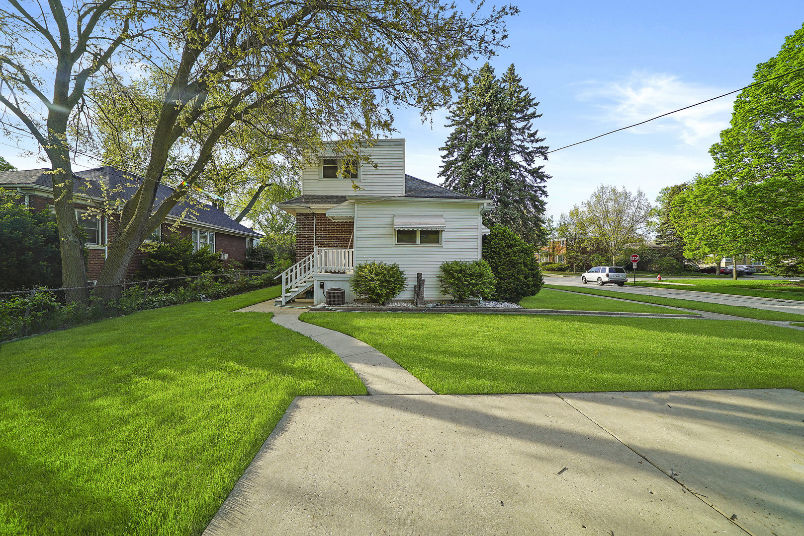 225 East Quincy Street Riverside, IL 60546 - Photo 30 of 32 a front view of house with yard and green space