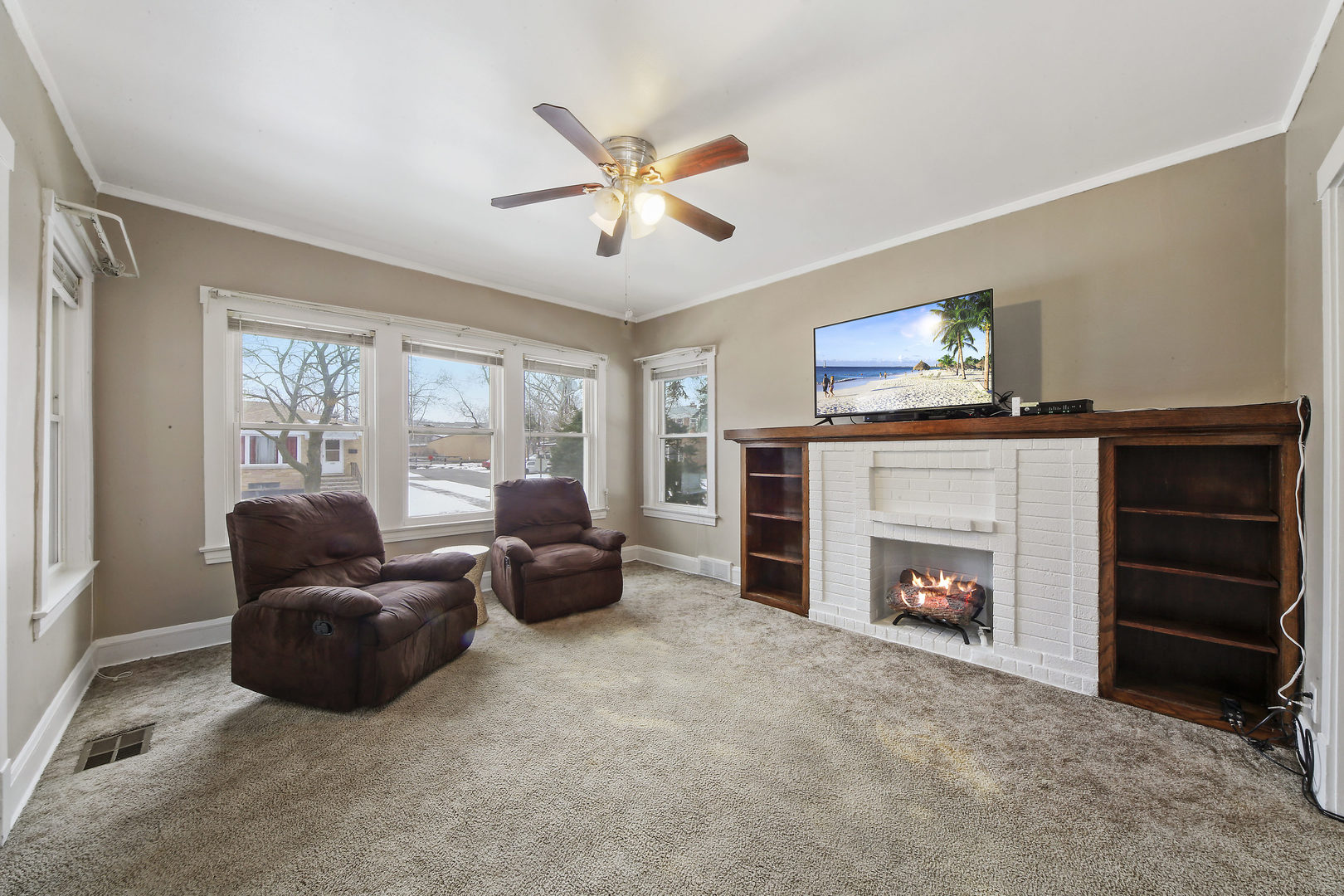 225 East Quincy Street Riverside, IL 60546 - Photo 4 of 32 a living room with furniture and a fireplace