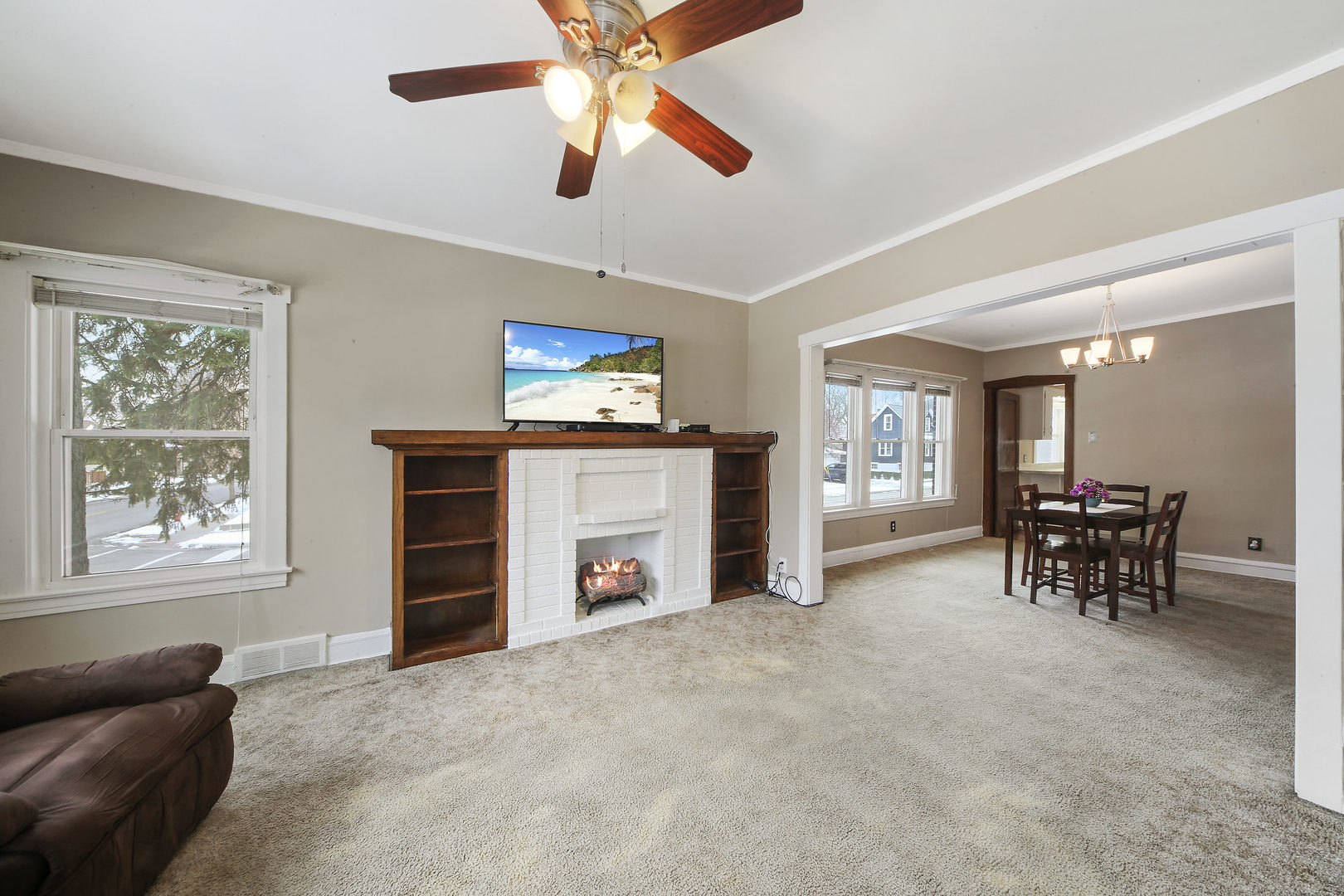 225 East Quincy Street Riverside, IL 60546 - Photo 5 of 32 a view of a livingroom with furniture and a flat screen tv