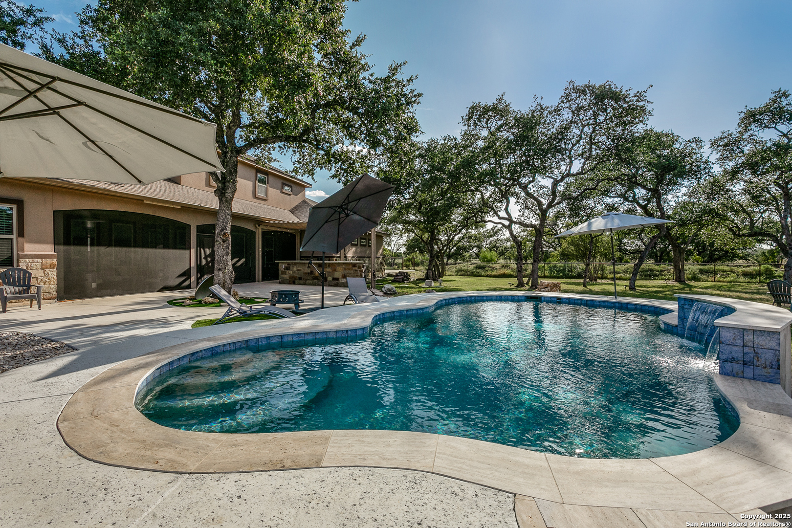 1118 Springfield Drive Spring Branch, TX 78070 - Photo 3 of 31 a view of swimming pool with a patio