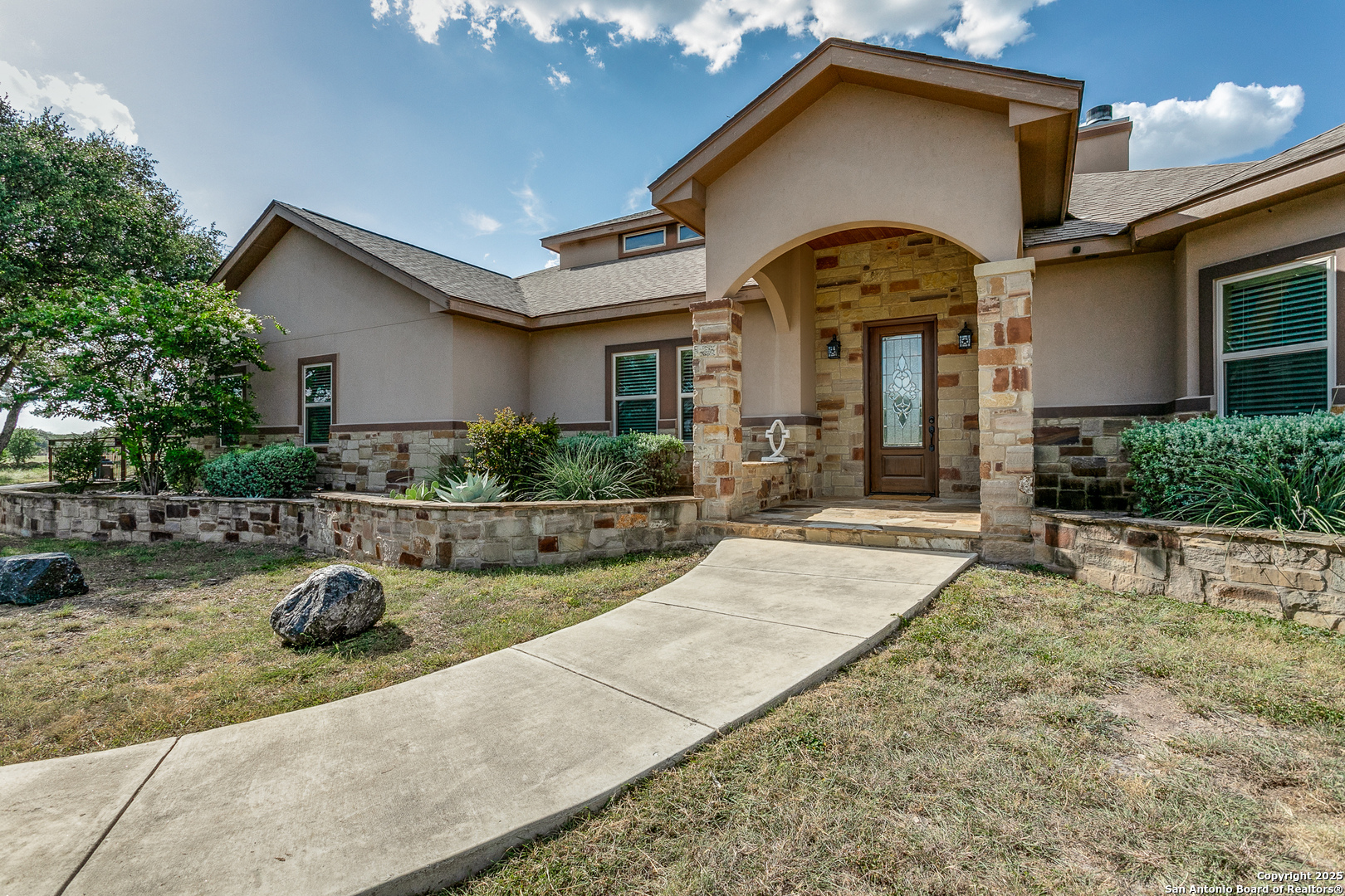 1118 Springfield Drive Spring Branch, TX 78070 - Photo 6 of 31 a front view of a house with garden