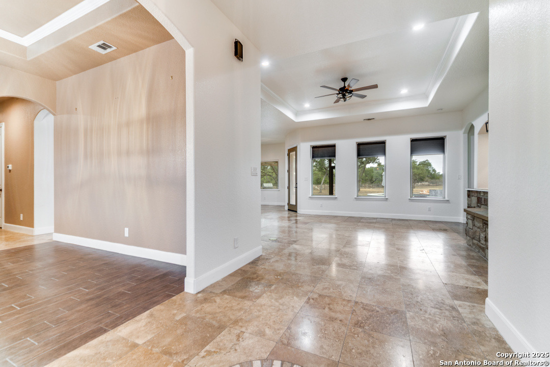 1118 Springfield Drive Spring Branch, TX 78070 - Photo 7 of 31 wooden floor in an empty room with a window