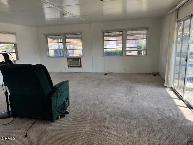 a living room with furniture and windows