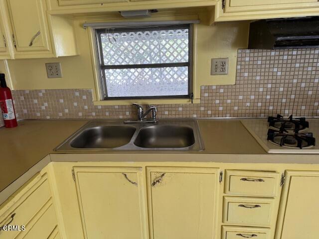 1500 Richmond Road, Unit 1 Santa Paula, CA 93060 - Photo 10 of 20 a kitchen with a sink a stove and cabinets