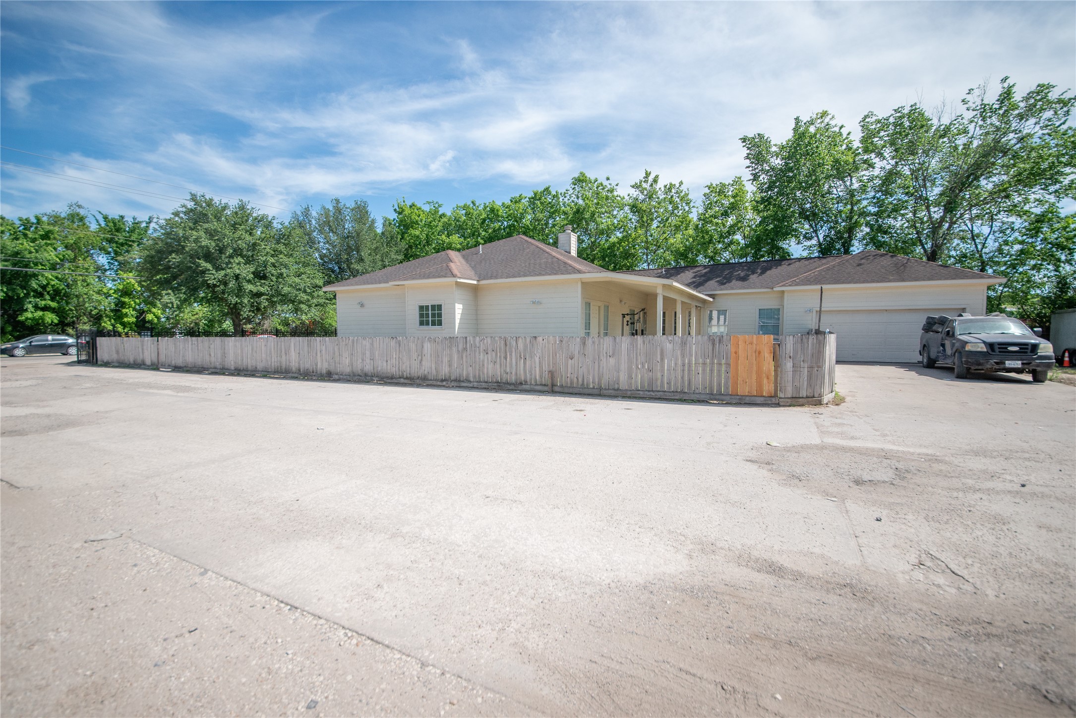 6309 East Houston Road Houston, TX 77028 - Photo 10 of 17 a front view of a house with a yard and garage