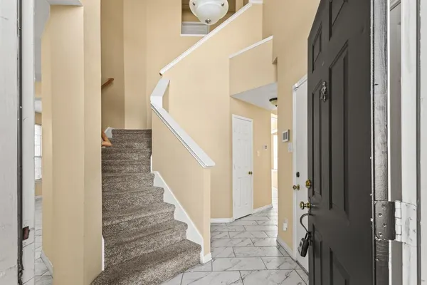 a view of a hallway with of the door