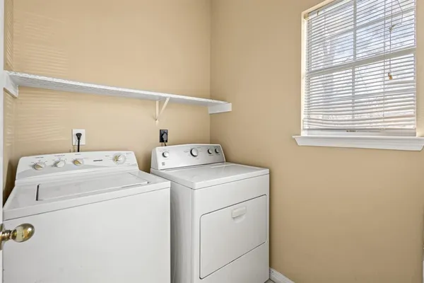 a utility room with dryer and washer