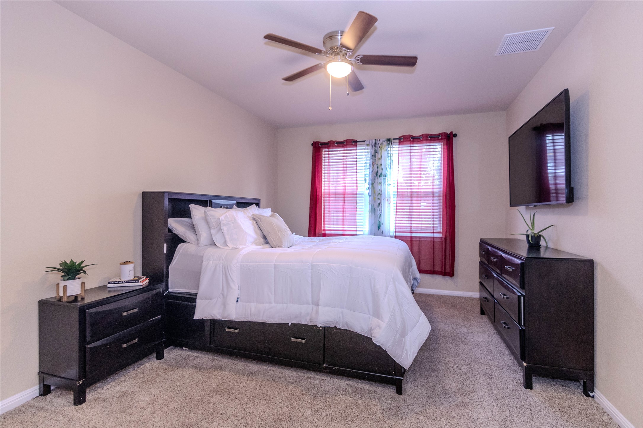 1501 Gropius Lane, Unit 30B Pflugerville, TX 78660 - Photo 12 of 30 Bedroom with light carpet and ceiling fan