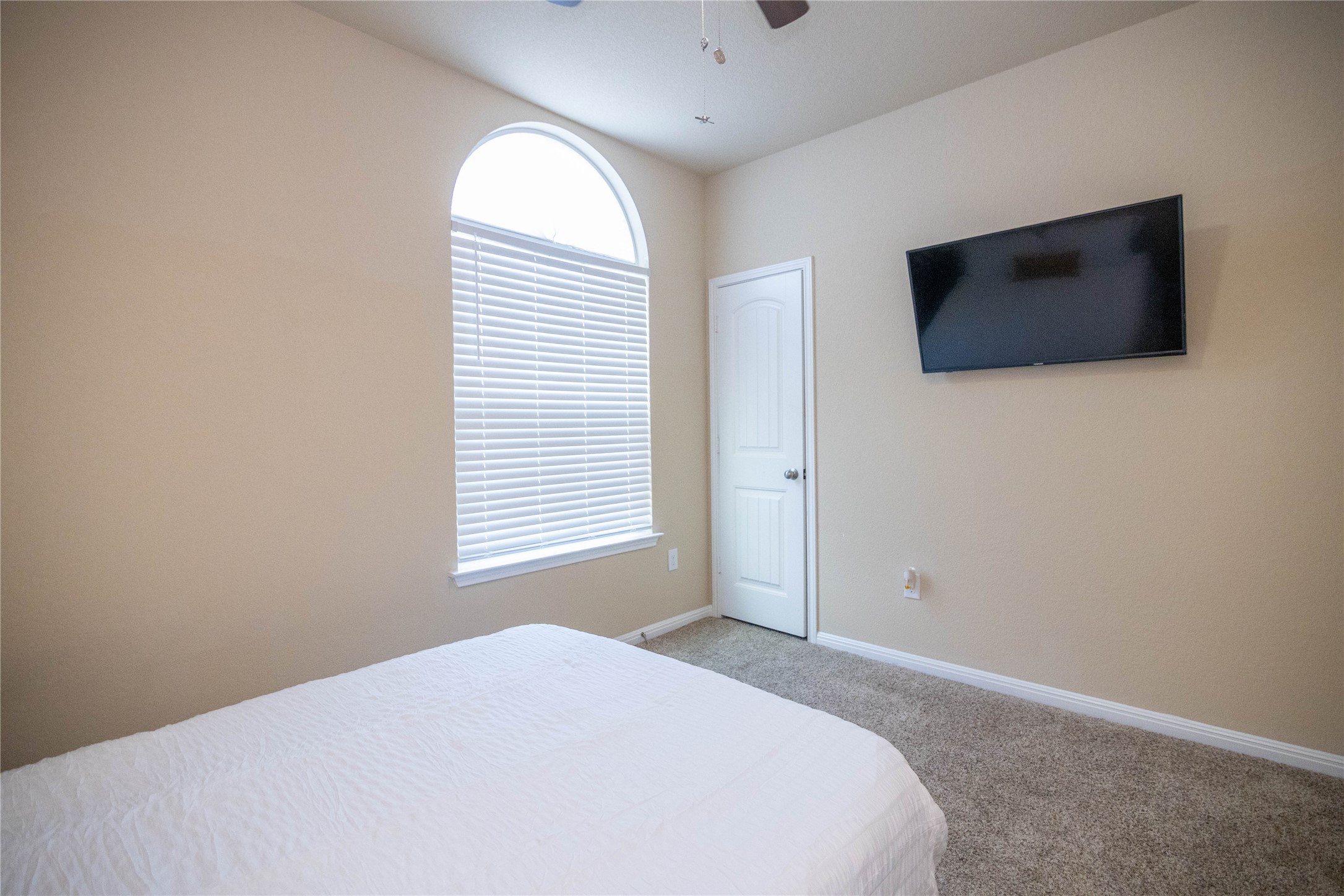 1501 Gropius Lane, Unit 30B Pflugerville, TX 78660 - Photo 19 of 30 Bedroom with light carpet and ceiling fan