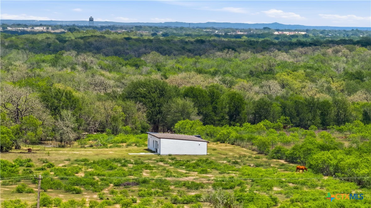 a backyard of a house with a yard and lake view
