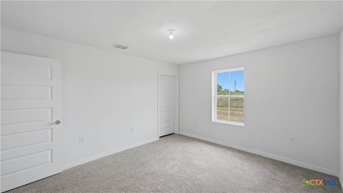 950 Highsmith Road Luling, TX 78648 - Photo 22 of 36 a view of an empty room with a window
