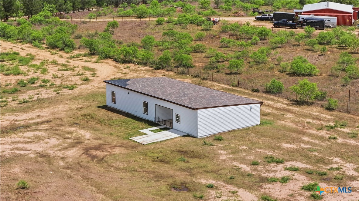 950 Highsmith Road Luling, TX 78648 - Photo 4 of 36 a view of a house with a yard