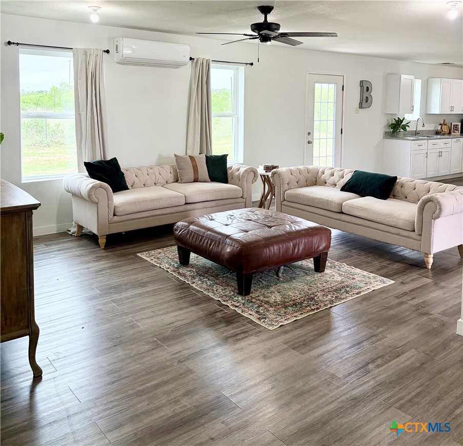 950 Highsmith Road Luling, TX 78648 - Photo 5 of 36 a living room with furniture and a wooden floor