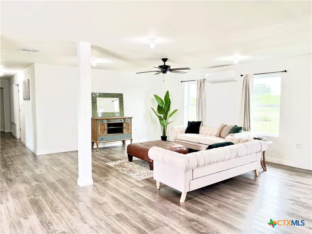 950 Highsmith Road Luling, TX 78648 - Photo 6 of 36 a living room with furniture and a wooden floor