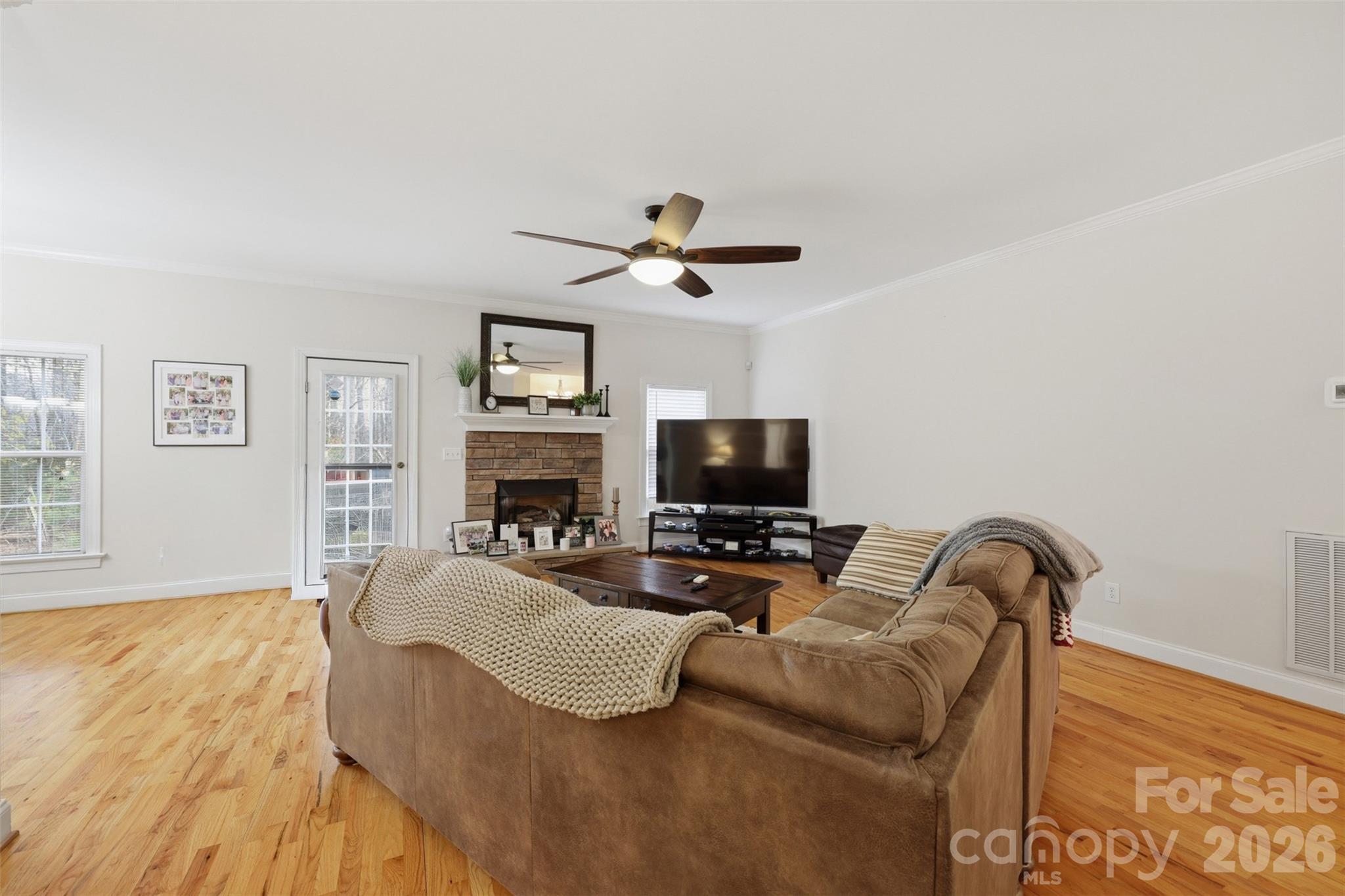 7594 Church Road Taylorsville, NC 28681 - Photo 19 of 34 a living room with furniture a flat screen tv and a fireplace