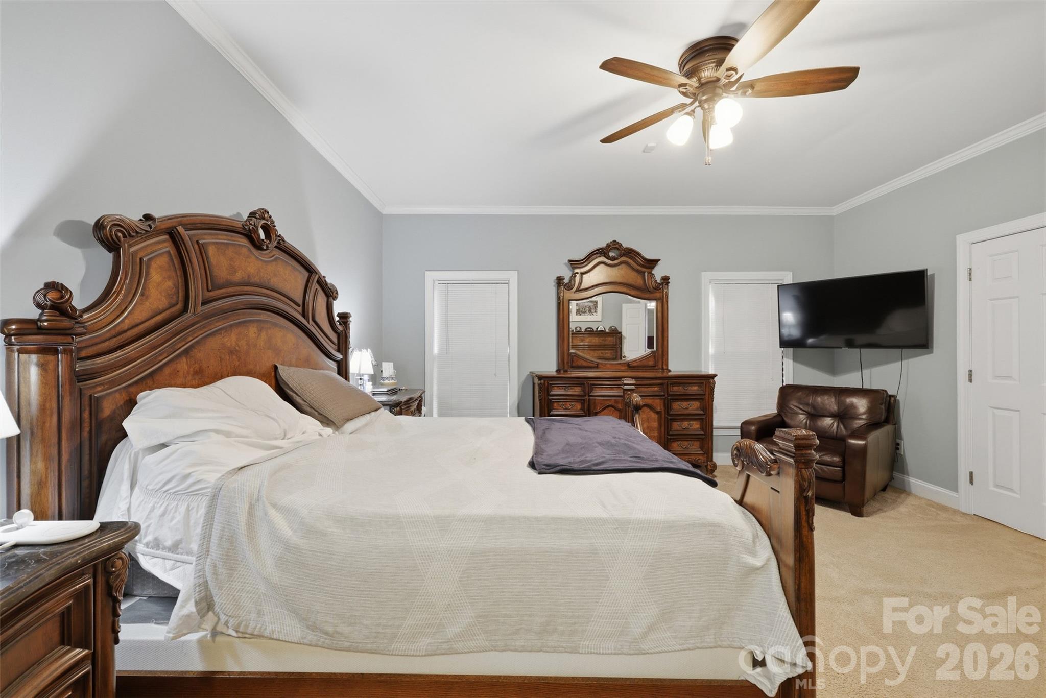 7594 Church Road Taylorsville, NC 28681 - Photo 22 of 34 a bedroom with a bed and a flat tv screen on the dresser