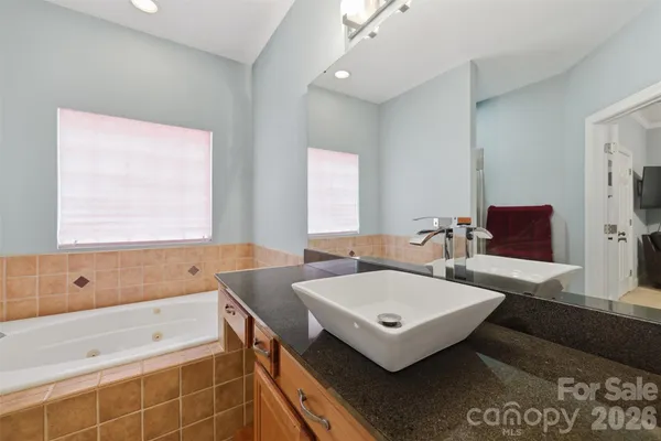 a bathroom with a sink and a bathtub